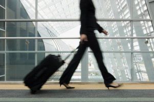 Woman walking with Traveling Bag - Travel Document Services in Los Angeles, CA